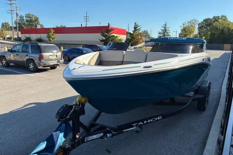Slide: The Image of 2027 Tahoe 210 S boat on trailer in parking lot, sunny day. - 7