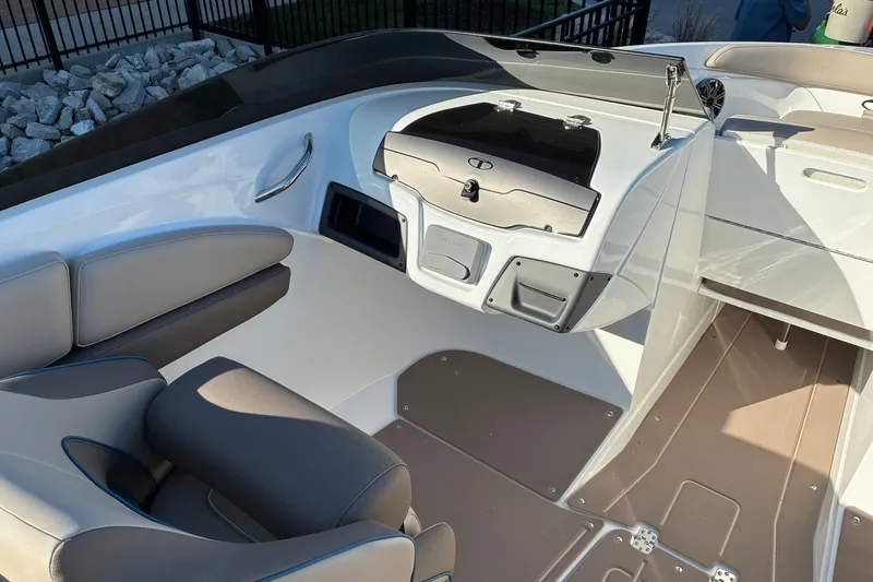 Slide: The Image of Interior of a 2027 Tahoe 210 S boat, featuring sleek seating and modern design. - 11