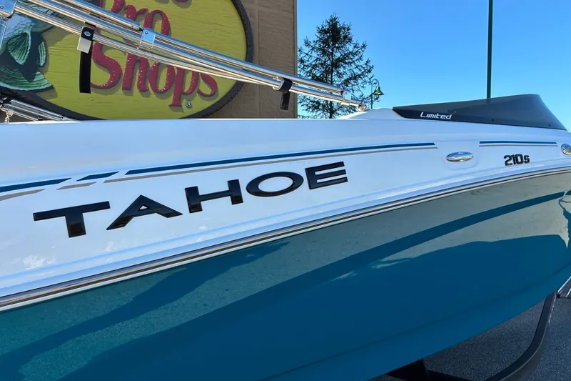Slide: The Image of 2027 Tahoe 210 S boat with sleek design and vibrant blue accents. - 2