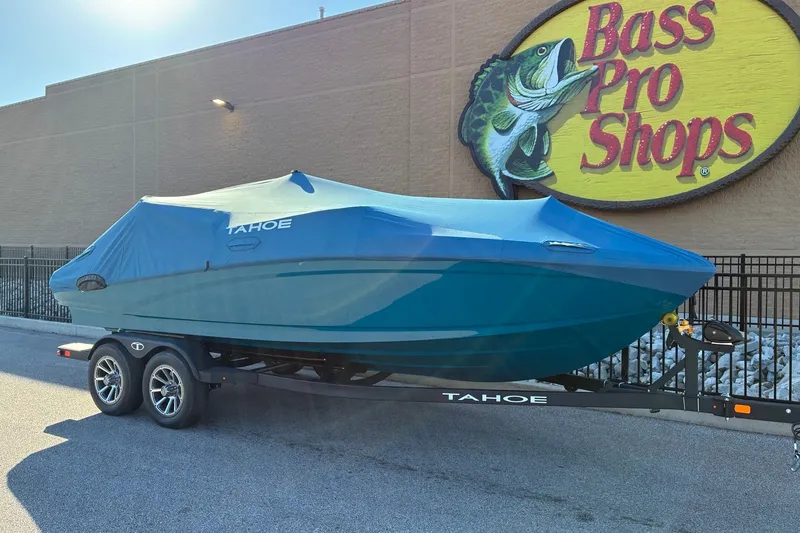 Slide: The Image of 2027 Tahoe 210 S boat covered, parked outside Bass Pro Shops. - 19