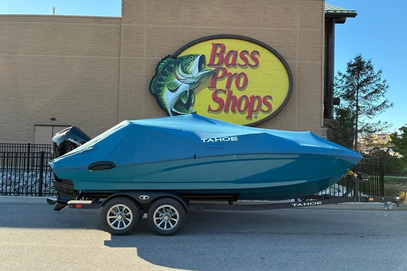 Slide: The Image of 2027 Tahoe 210 S boat covered, parked outside Bass Pro Shops. - 18