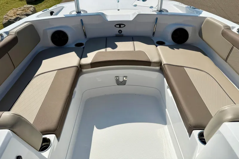 Slide: The Image of Spacious seating area of 2027 Tahoe 2150 boat with beige and brown upholstery. - 14