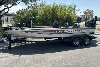 The Image of 2026 Tracker Savage 215 boat on trailer, parked outdoors. - 0