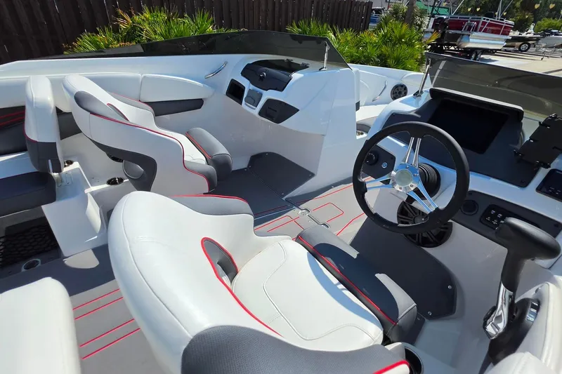 Slide: The Image of Interior of 2027 Tahoe 210 S boat with modern steering and seating. - 15
