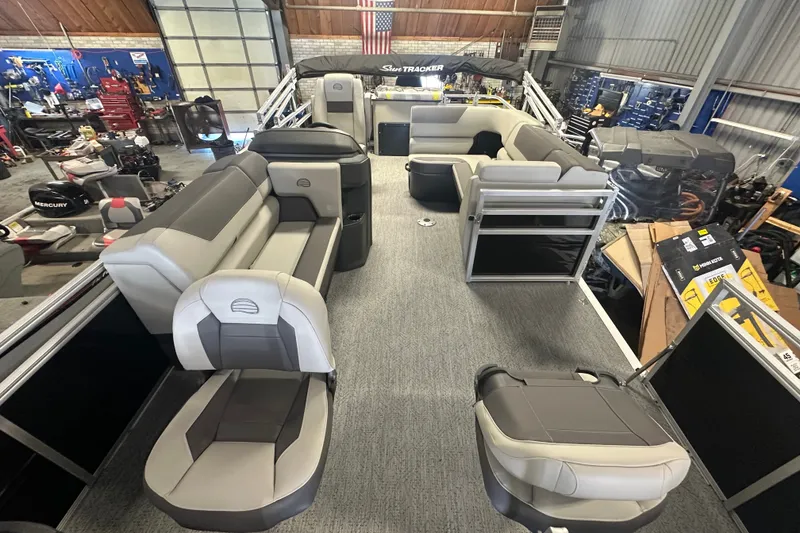 Slide: The Image of 2027 Sun Tracker Fishin' Barge 20 DLX interior with spacious seating and modern design. - 16