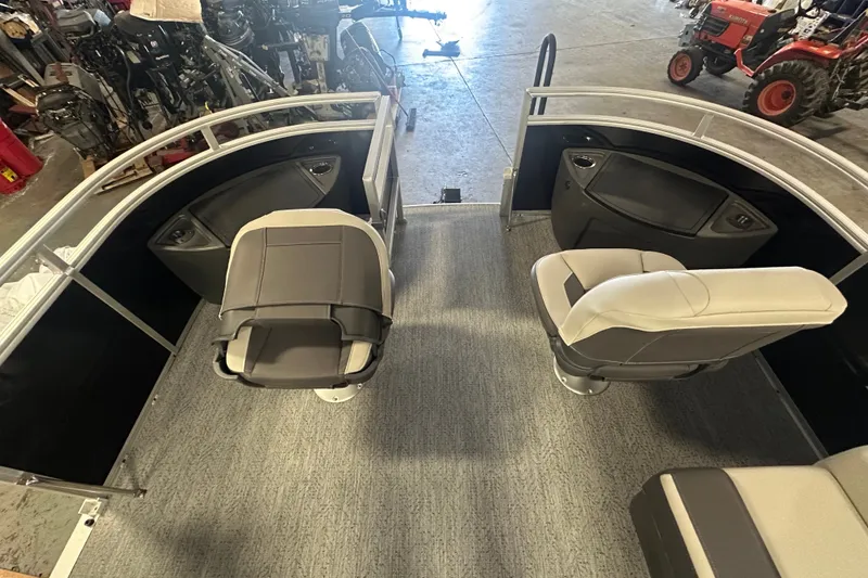 Slide: The Image of 2027 Sun Tracker Fishin' Barge 20 DLX interior with seating and storage compartments. - 15