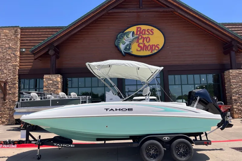 The Image of 2027 Tahoe 2150 boat displayed outside Bass Pro Shops store. - 0