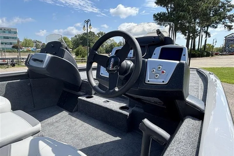 Slide: The Image of 2027 Tracker Pro Team 195 boat interior with steering wheel and control panel. - 16