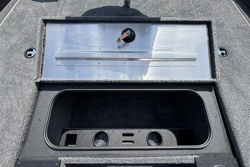 Slide: The Image of 2027 Tracker Pro Team 195 boat storage compartment with secure lock and speakers. - 13