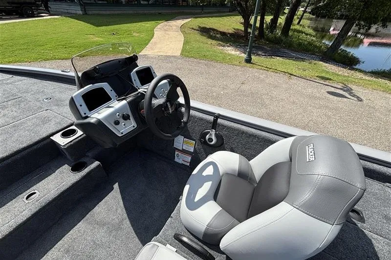 Slide: The Image of 2027 Tracker Pro Team 195 boat interior with steering wheel and seating. - 15