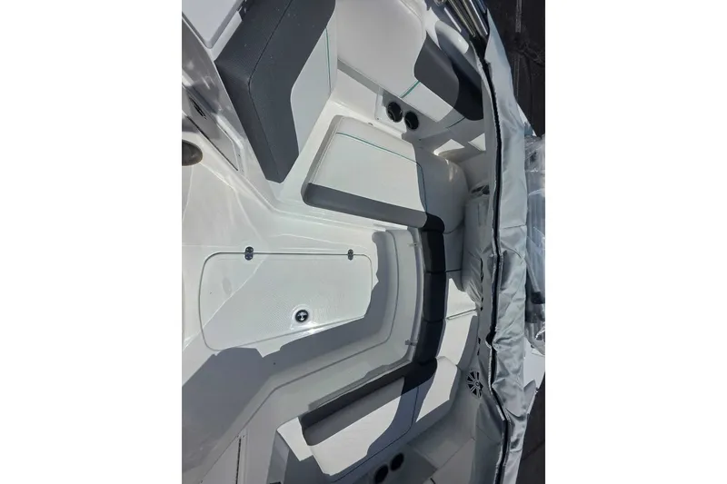 Slide: The Image of Interior view of 2027 Tahoe 2150 CC boat, featuring sleek seating and modern design. - 9