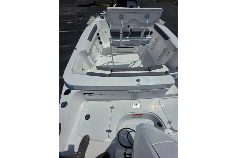 Slide: The Image of 2027 Tahoe 2150 CC boat interior with seating and console, viewed from above. - 12