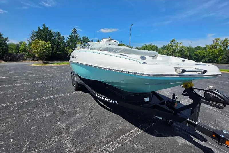 Slide: The Image of 2027 Tahoe 2150 CC boat on trailer in sunny parking lot. - 6