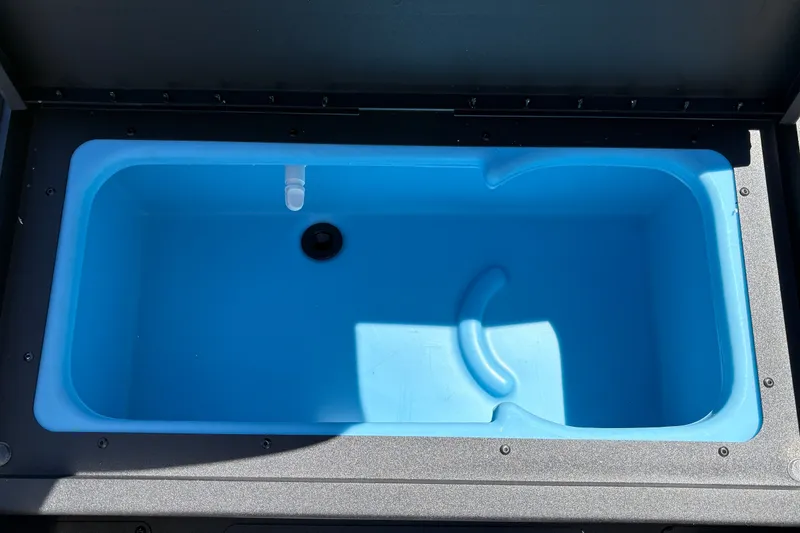 Slide: The Image of Blue livewell in 2027 Tracker Pro 170 boat, featuring drain and aeration system. - 32