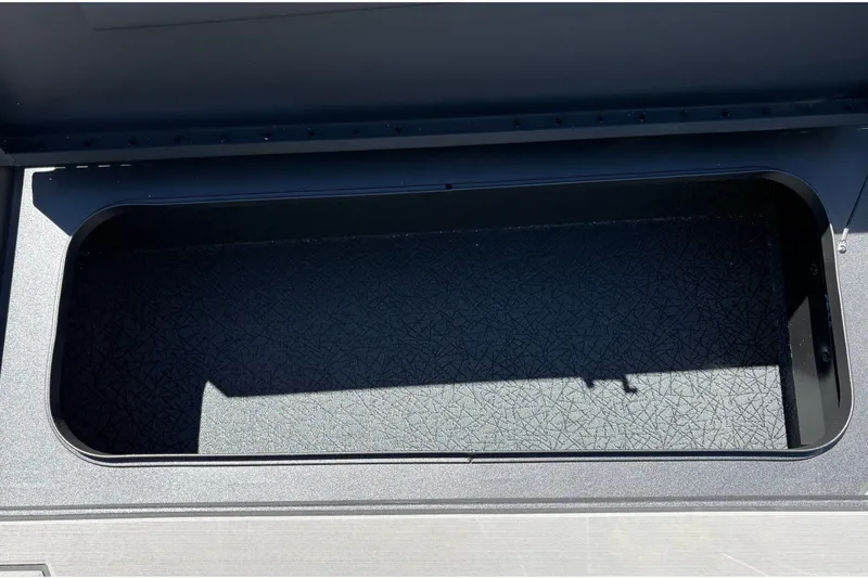 Slide: The Image of Open storage compartment in 2027 Tracker Pro 170 boat. - 33