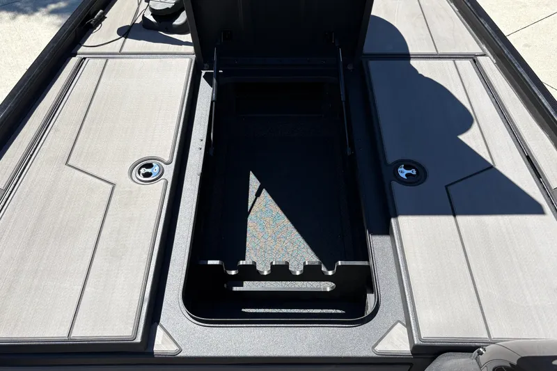 Slide: The Image of 2027 Tracker Pro 170 boat storage compartment with open hatch, showcasing interior design. - 21