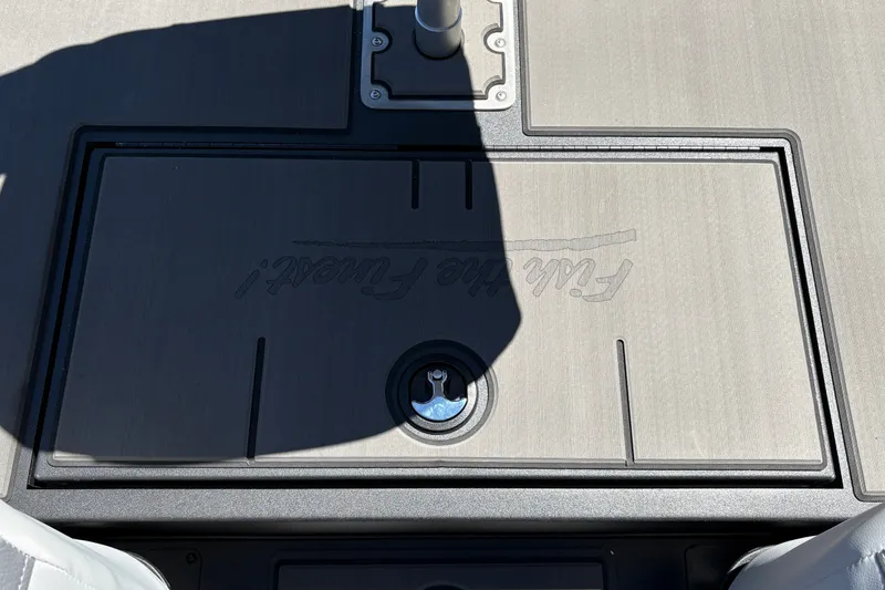 Slide: The Image of 2027 Tracker Pro 170 boat deck with storage compartment and shadow. - 29