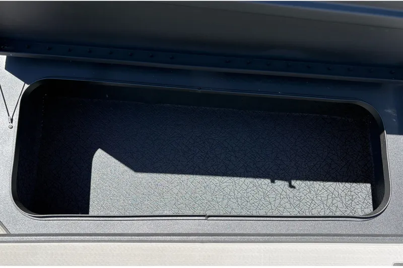 Slide: The Image of Open storage compartment in 2027 Tracker Pro 170 boat. - 34