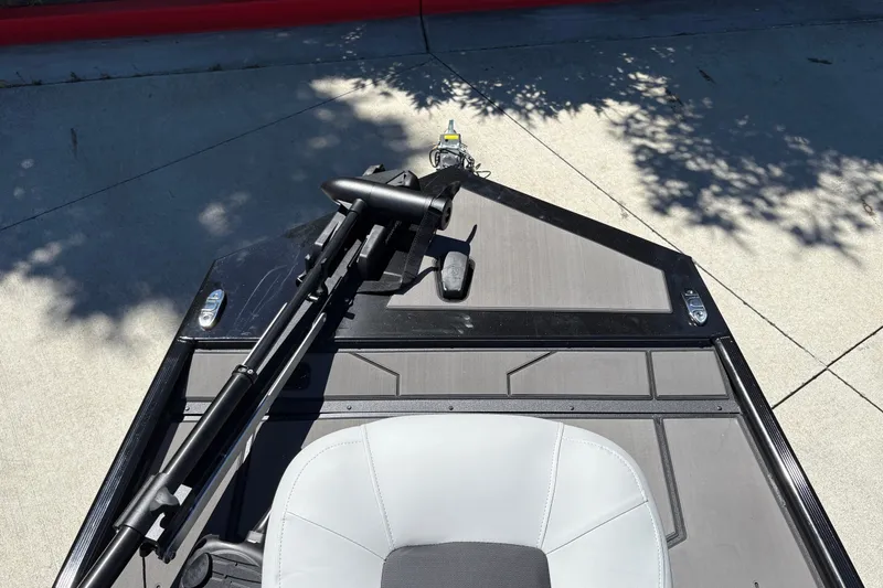 Slide: The Image of 2027 Tracker Pro 170 boat deck with trolling motor and seat in sunlight. - 22