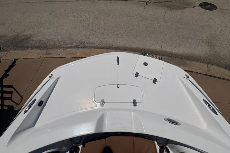 Slide: The Image of Top view of 2027 Tahoe 2150 boat deck, showcasing sleek design and storage compartments. - 9