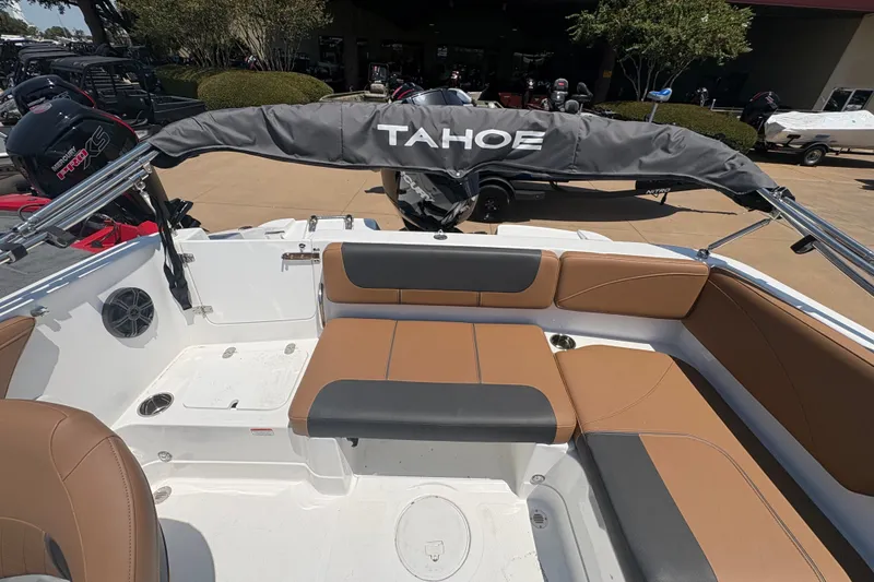 Slide: The Image of 2027 Tahoe 2150 boat interior with tan and black seating, showcasing spacious design. - 13