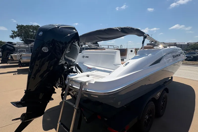 Slide: The Image of A modern 2027 Tahoe 2150 sits on a trailer. The outboard motor is visible. - 3