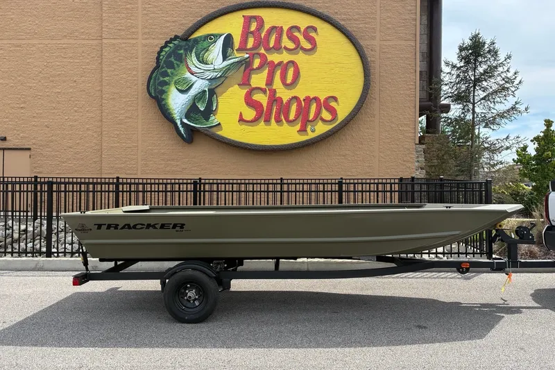 The Image of 2027 Tracker Grizzly 1648 Utility boat on trailer, parked at Bass Pro Shops. - 0