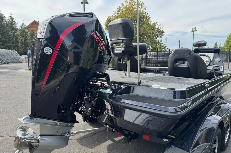 Slide: The Image of 2027 Nitro Z18 XL Pro boat with Mercury Pro outboard motor, parked outdoors. - 10