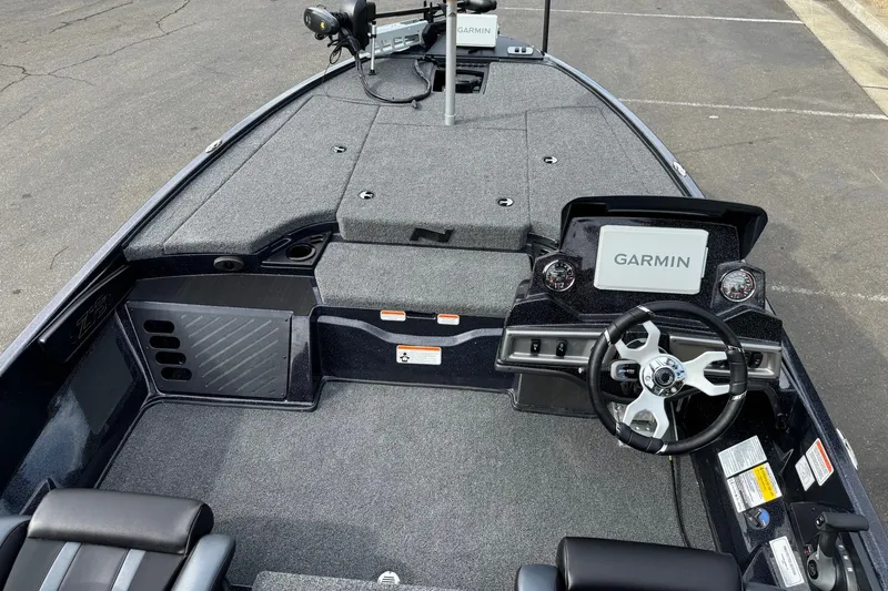 Slide: The Image of 2027 Nitro Z18 XL Pro boat interior with Garmin navigation system and steering wheel. - 6