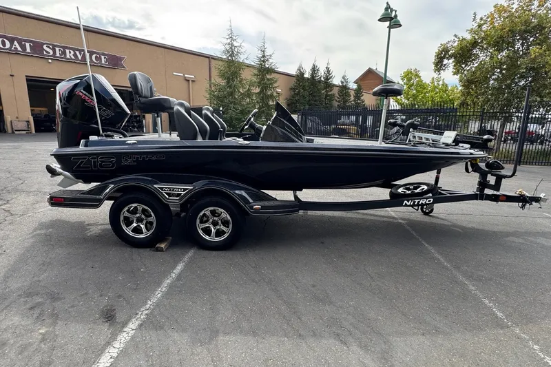 Slide: The Image of 2027 Nitro Z18 XL Pro boat on trailer, parked outside service center. - 4