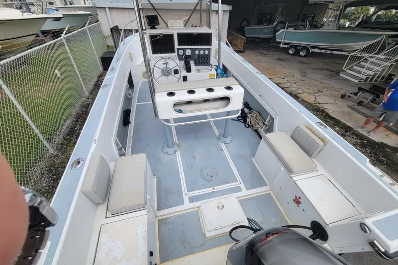 Slide: The Image of 1990 Grady-White Fisherman 204 boat interior with seating and control panel. - 5