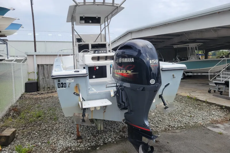 Slide: The Image of 1990 Grady-White Fisherman 204 boat with Yamaha 150 outboard motor in storage. - 2