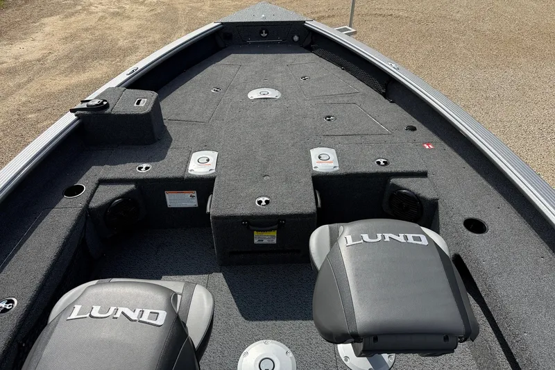 Slide: The Image of 2027 Lund 1875 Pro Guide boat interior with seating and storage compartments. - 4
