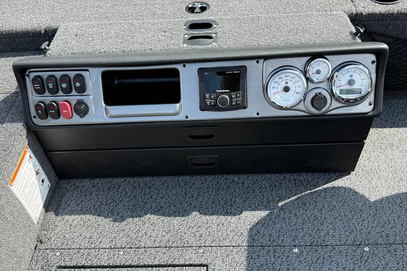 Slide: The Image of Dashboard of 2027 Lund 1875 Pro Guide boat with gauges and controls. - 13