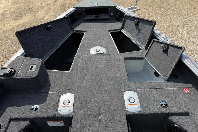 Slide: The Image of 2027 Lund 1875 Pro Guide boat interior with open storage compartments on deck. - 5