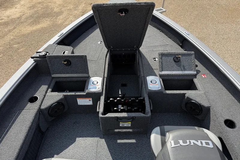 Slide: The Image of 2027 Lund 1875 Pro Guide boat interior with storage compartments and seating. - 7