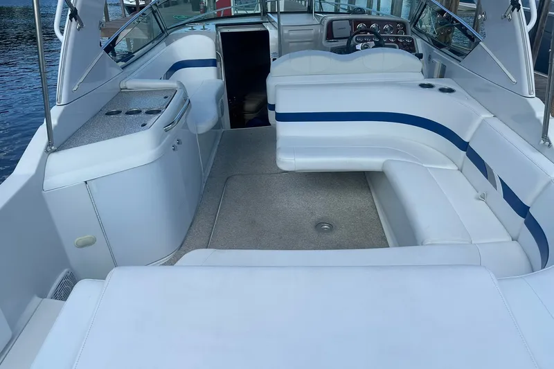 Slide: The Image of 2004 Formula 280 Sun Sport boat interior with white seating and control panel. - 9