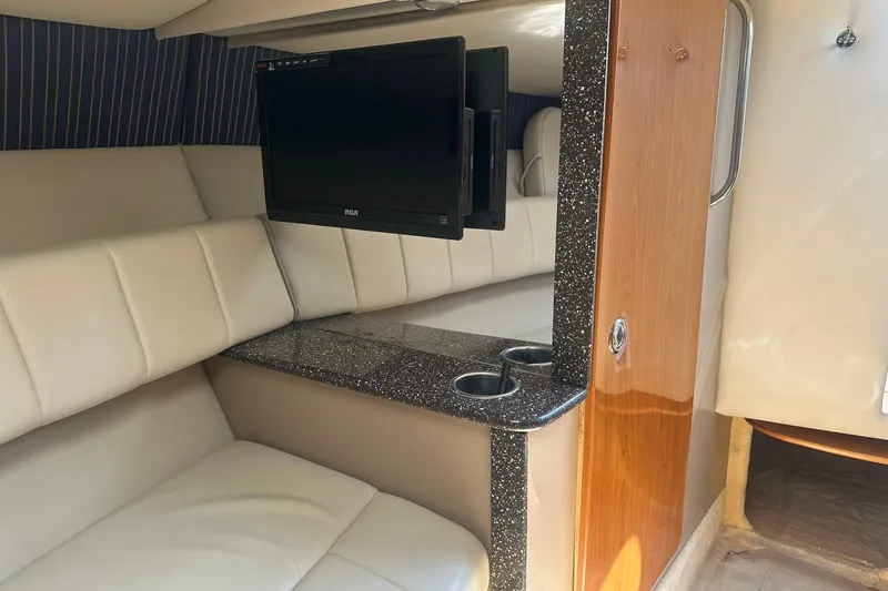 Slide: The Image of Interior of 2004 Formula 280 Sun Sport boat with TV and seating area. - 25
