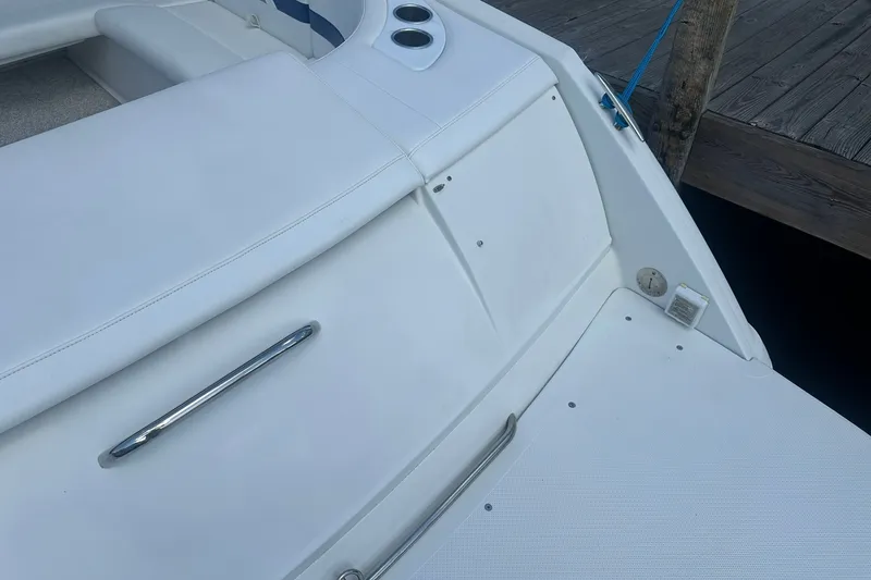 Slide: The Image of 2004 Formula 280 Sun Sport boat interior with white seating and stainless steel accents. - 8