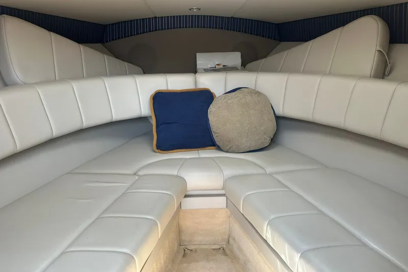 Slide: The Image of Interior of a 2004 Formula 280 Sun Sport boat with white seating and cushions. - 24