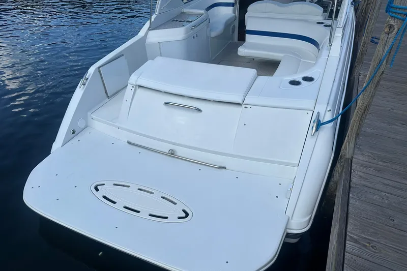Slide: The Image of 2004 Formula 280 Sun Sport boat docked, featuring spacious seating and swim platform. - 6