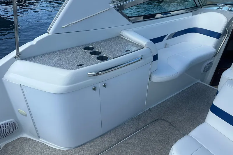 Slide: The Image of 2004 Formula 280 Sun Sport boat interior with seating and cup holders. - 11