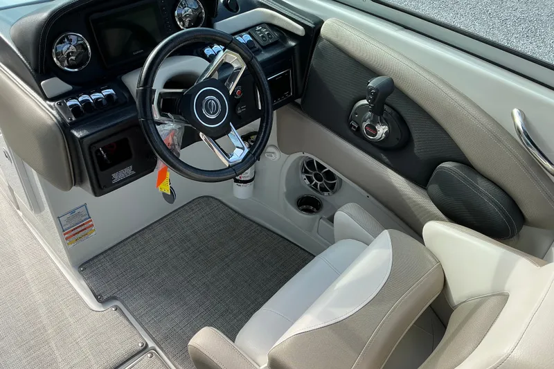 Slide: The Image of 2020 Crownline 290 SS boat cockpit with steering wheel and control panel. - 7