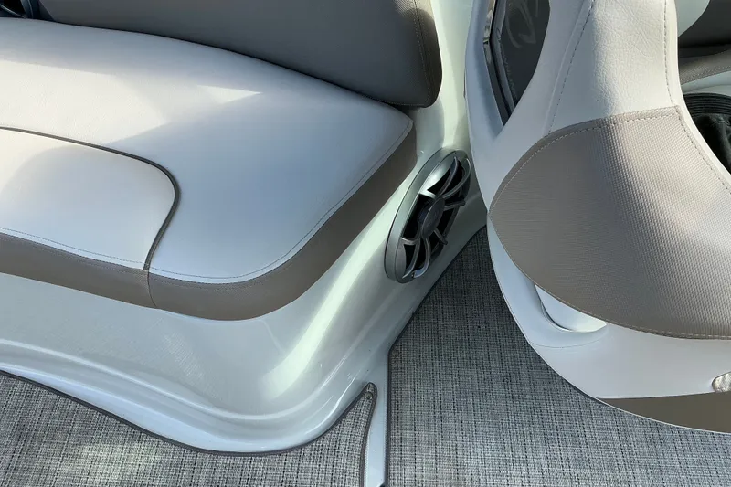 Slide: The Image of 2020 Crownline 290 SS boat interior with cushioned seating and speaker detail. - 12