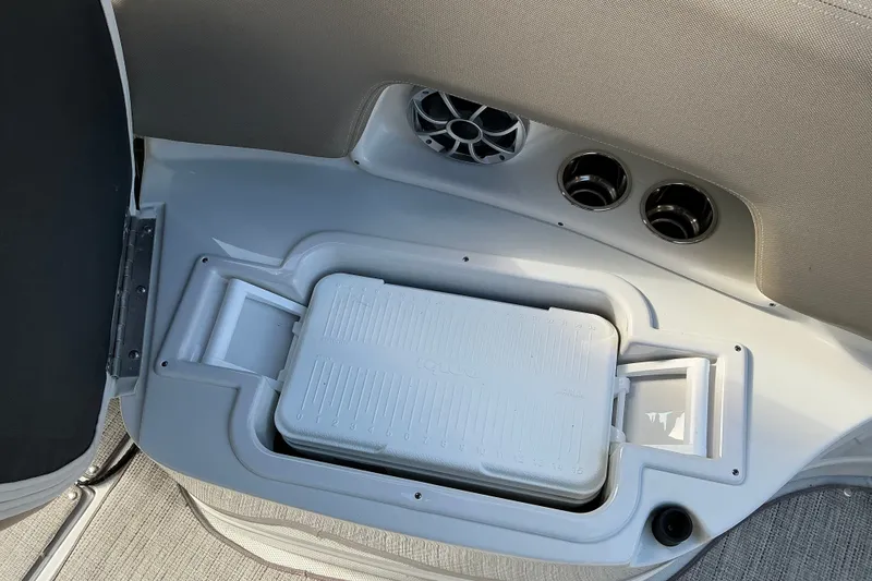 Slide: The Image of Crownline 290 SS 2020 boat cooler compartment with speaker and vents. - 5