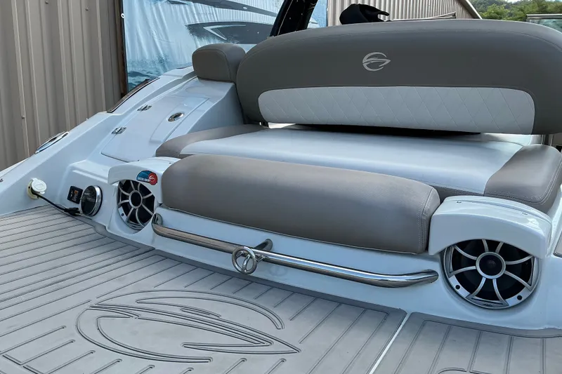 Slide: The Image of 2020 Crownline 290 SS boat interior with cushioned seating and built-in speakers. - 3