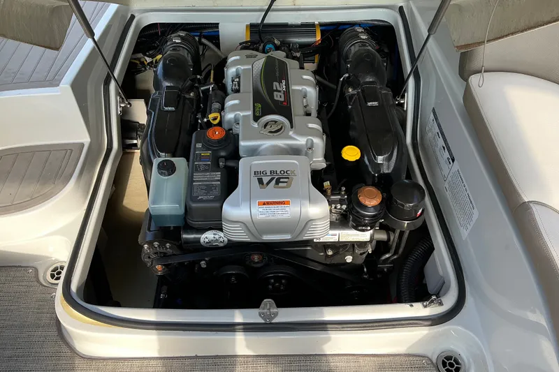 Slide: The Image of Engine compartment of a 2020 Crownline 290 SS boat, featuring a Big Block V8 engine. - 6