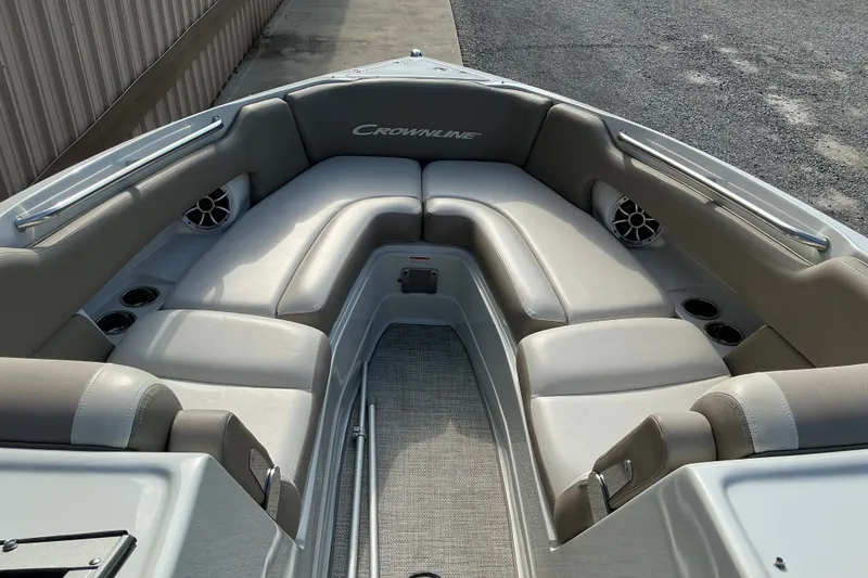 Slide: The Image of 2020 Crownline 290 SS boat interior with spacious seating and cup holders. - 10