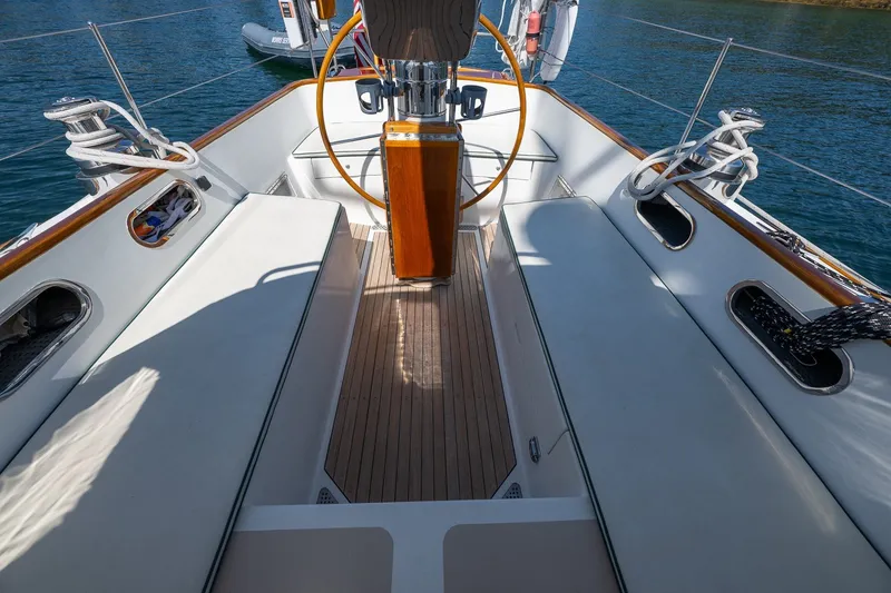 Slide: The Image of Hinckley Sou'wester 42 sailboat cockpit, 1987 model, featuring teak flooring and elegant design. - 23