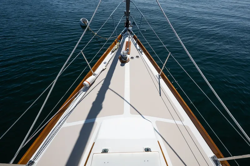 Slide: The Image of Bow view of 1987 Hinckley Sou'wester 42 sailboat on calm water. - 7